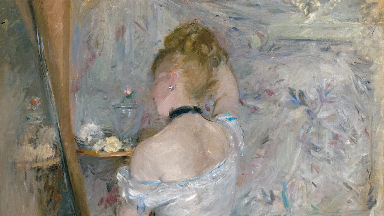 A woman with her back to the viewer, her hair in a bun, is captured in the soft, light-filled style of impressionist paintings.
